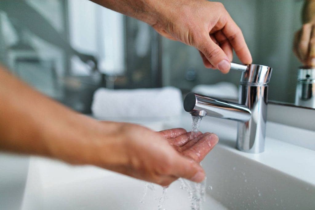 person washing hands